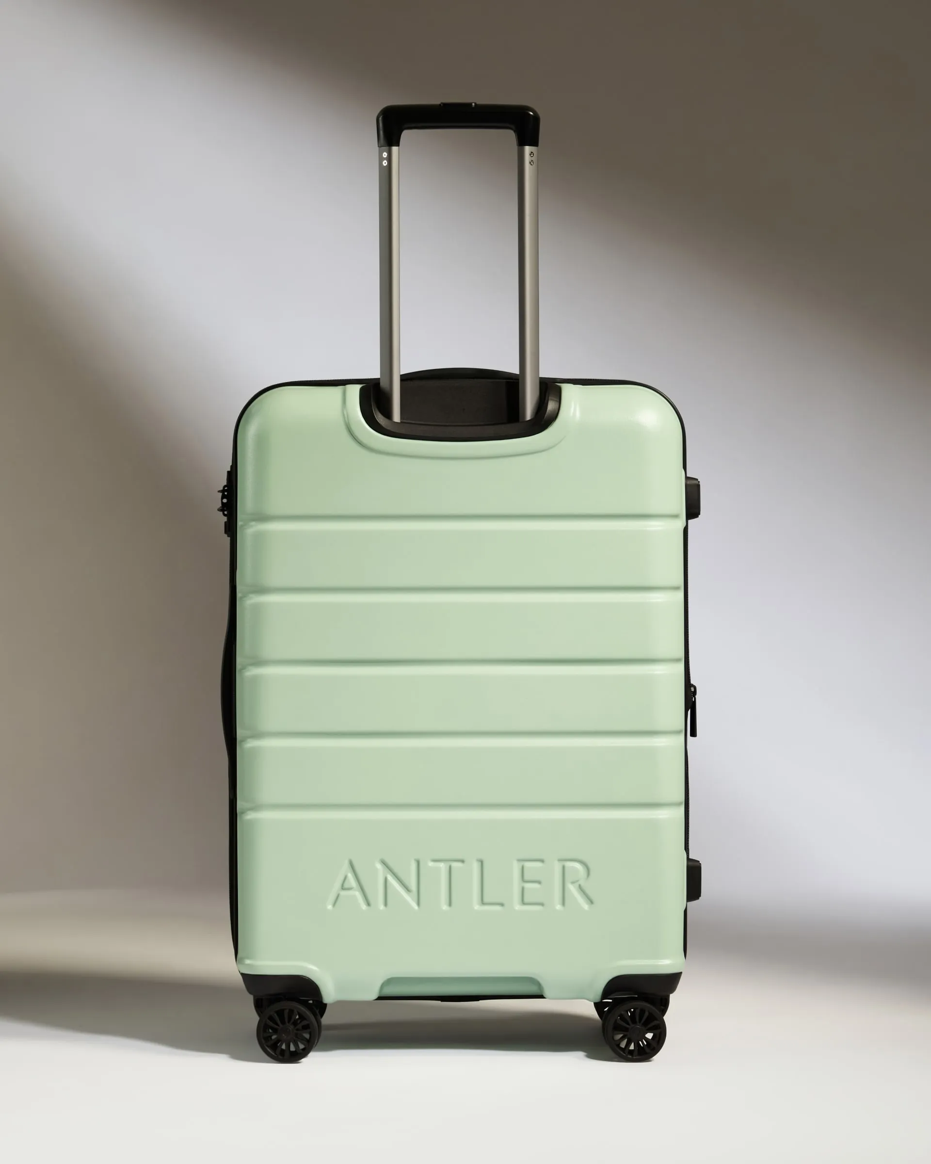 Optimized Title: Stylish Medium Aspen Green Suitcase with Logo