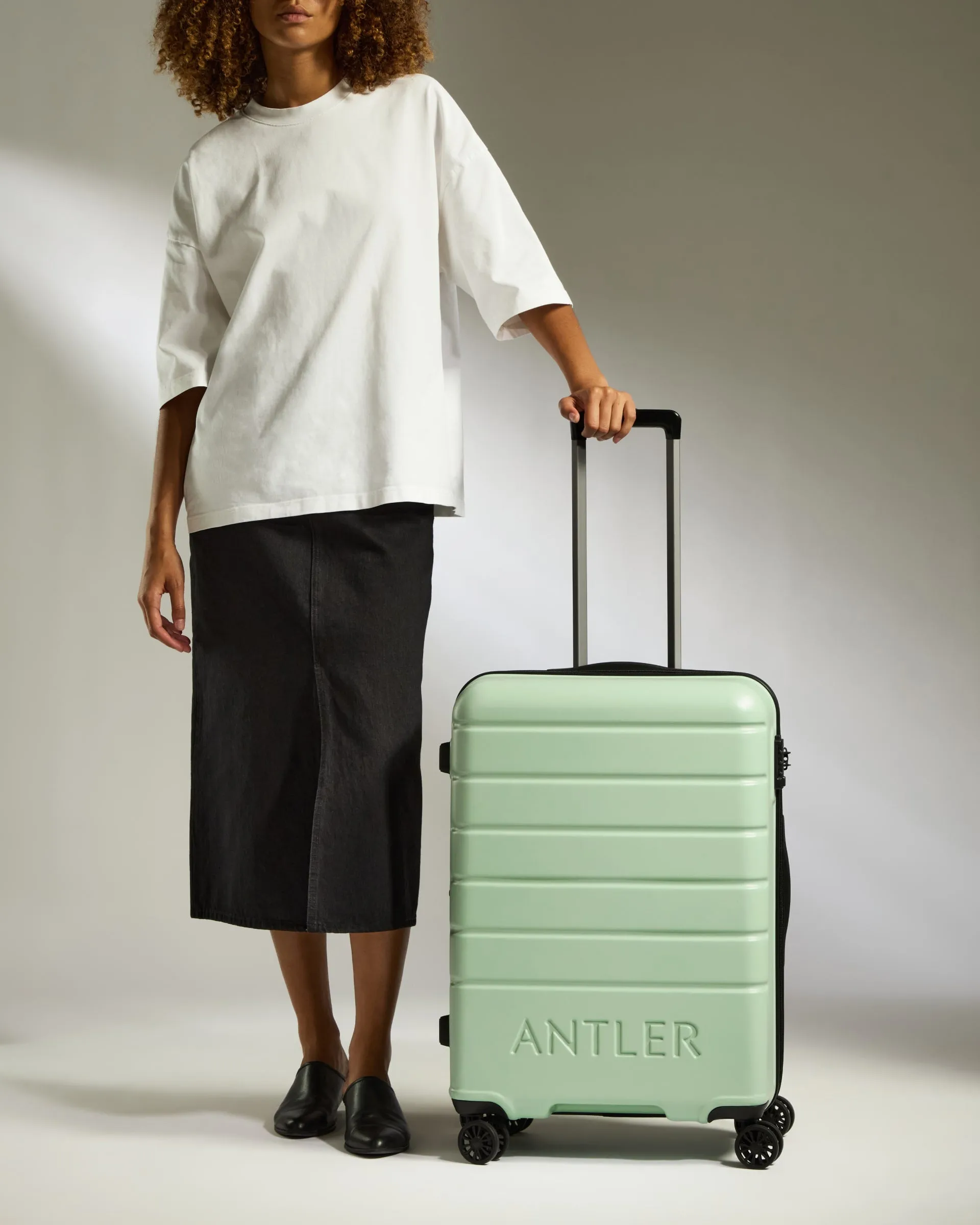Optimized Title: Stylish Medium Aspen Green Suitcase with Logo