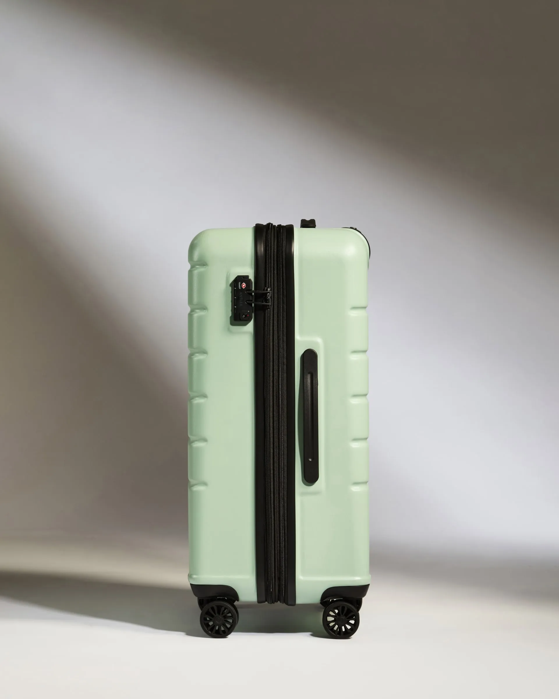 Optimized Title: Stylish Medium Aspen Green Suitcase with Logo