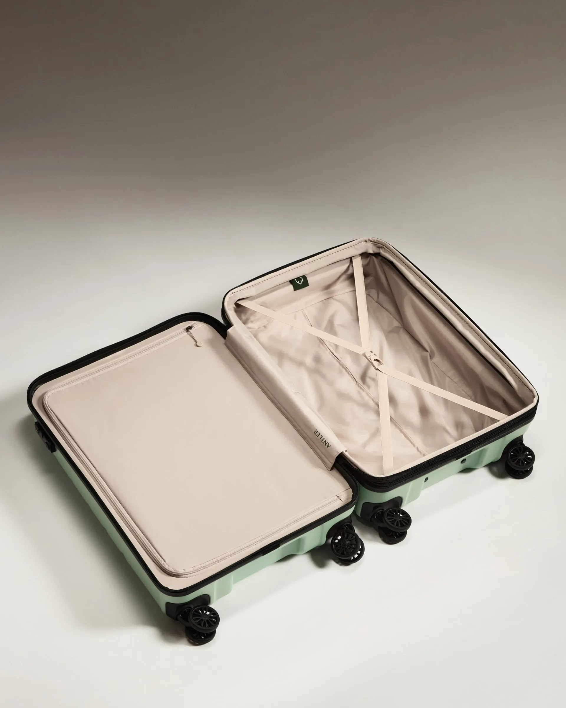 Optimized Title: Stylish Medium Aspen Green Suitcase with Logo